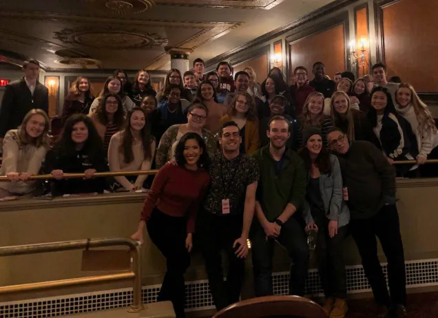 large group of young adults in the theater