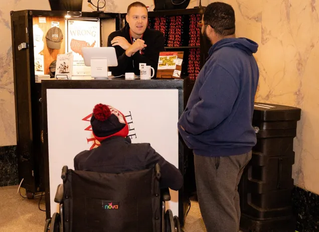 people shopping at gift shop counter