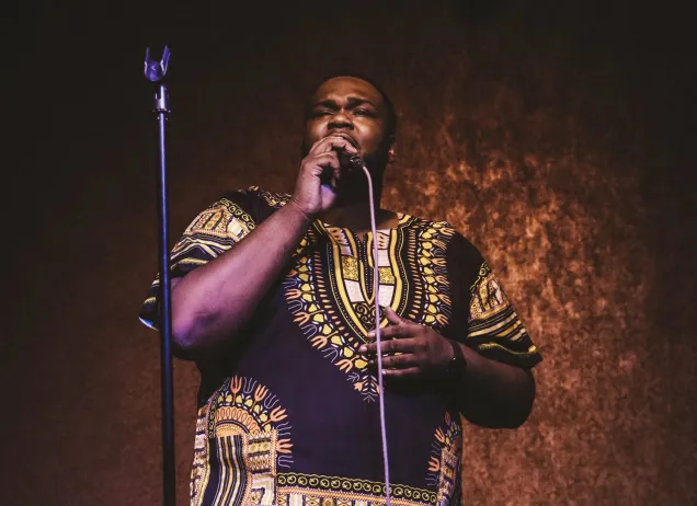 Man singing into a microphone